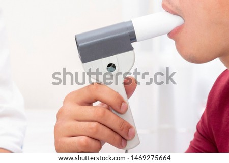device with which spirometry is performed is called spirometer. Spirometry is used to diagnose diseases such as bronchial asthma, COPD, to assess state of respiratory apparatus in other diseases Royalty-Free Stock Photo #1469275664