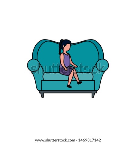 cute little girl seated in sofa