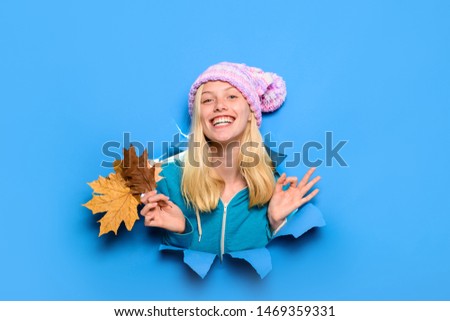Beauty and fashion. Blonde girl showing ok sign. Autumn time. Season autumn holidays. Autumn clothes collection. Smiling girl shows ok sign. Girl with leaves looking through paper hole. Smiling girl.