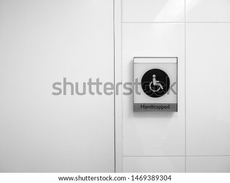 Handicapped symbol on black and white background