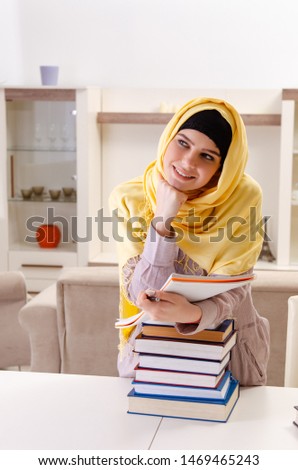 Female student in hijab preparing for exams 