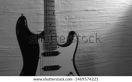 electric guitar . white wall background . closeup                             
