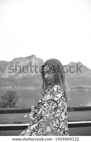 Tourism concept. Beautiful woman look at lake. Vacation in Salzburg