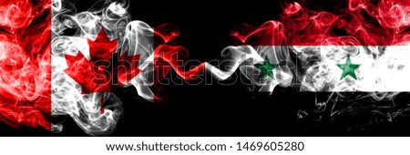 Canada vs Syria, Syrian smoky mystic flags placed side by side. Thick colored silky smoke flags of Canadian and Syria, Syrian