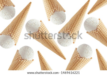 White creamy ice cream in crisp waffle cones as decorative random pattern isolated on white background.