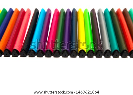 school. multi-colored felt-tip pens on a white background. felt-tip pens for the student.
