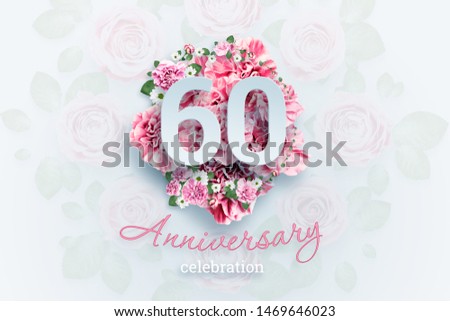 Creative background lettering 60 numbers and anniversary celebration text on pink flowers background. Anniversary concept, birthday, celebration event, template, flyer.