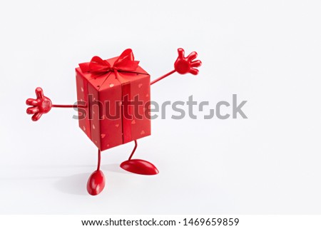 Gift in box. Red box on legs, with handles. Cartoon figure. Copy space.