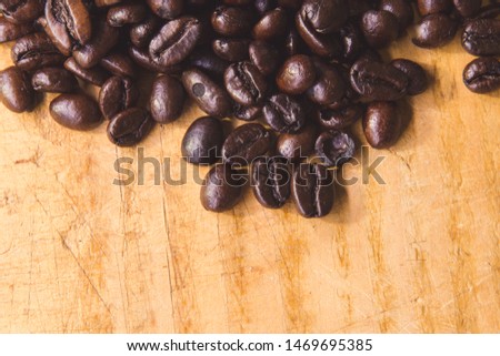 Coffee beans on a wooden table in vintage style