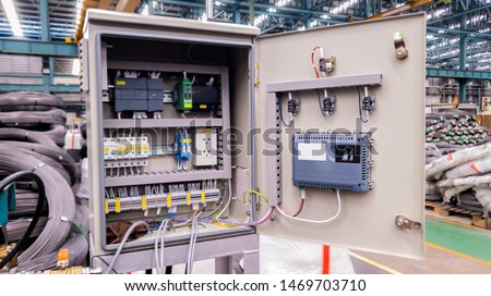 Electric control panel open enclosure for automatic circuit system in industrial factory, switchgear box technology on site Royalty-Free Stock Photo #1469703710