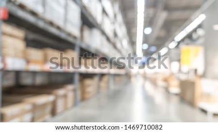 Warehouse industry blur background with  logistic wholesale storehouse, blurry industrial silo interior aisle for furniture merchandise inventory and wood material, construction supplies big box store Royalty-Free Stock Photo #1469710082