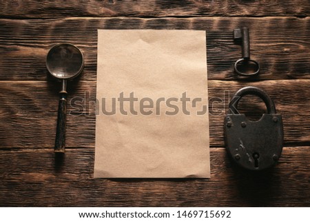 Top secret document with a confidential information mockup on a wooden table flat lay background.