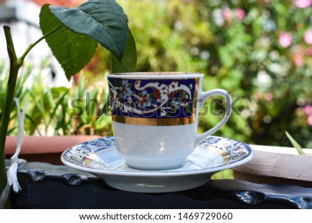 Turkish coffee, on green background. embroidered porcelain cup	