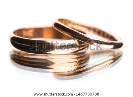 Gold wedding rings isolated on white background

