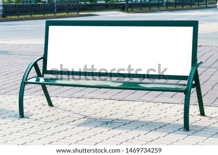 Billboard with blank white copy space for text message or content, mock up banner on a city bench, illuminated by sunlight 