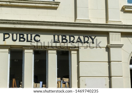 Public Library Sign with books in windows