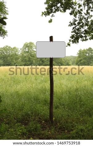Blank isolated white clipping nature sign, road sign in park on wooden post