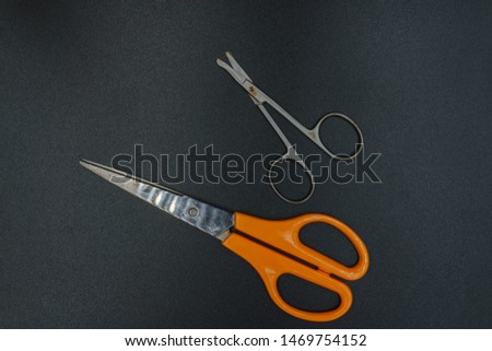 top view , scissors isolated on a black background