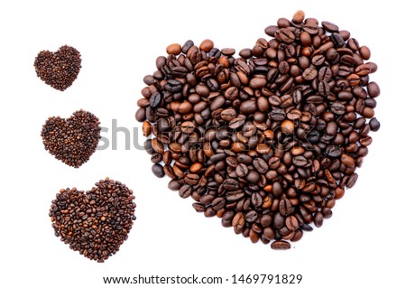 Heart shape made by coffee beans with white background.