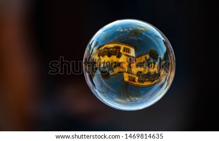 Building reflection on a soap bubble