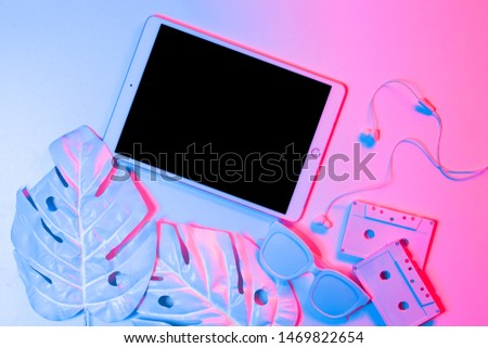 Tablet with keyboard, headphones background mockup concept. bright neon colors. minimal and surreal. style of the 80's