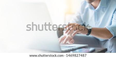 hand holding using typing computer.businessman at workplace in office Thinking investment plan.chatting contact Investor.searching for information use internet.connecting people concept