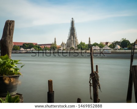 Wat Arun under construction and the river Chao Phraya in Bangkok - long exposure