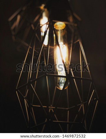 Interior photo, macro photo of a futuristic design lamp and an icicle bulb