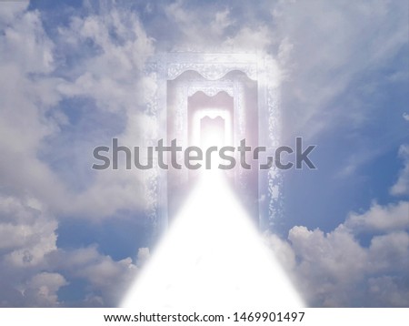 White road of light through a tunnel of doors among the clouds in the blue sky.