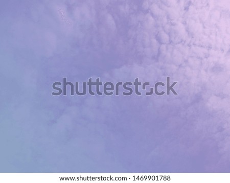 A soft cloud background with a pastel colored purple to blue gradient.for background.