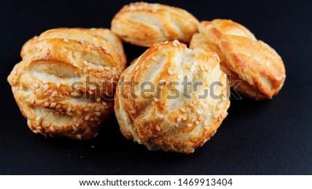 hot pastry pies with chicken and mushrooms on a dark background