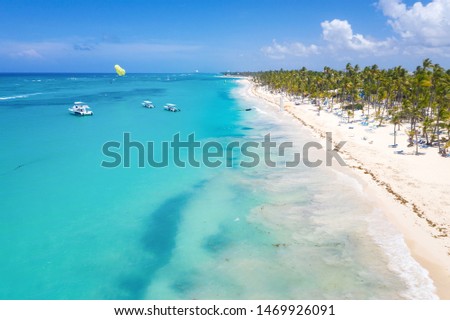 Aerial view from drone on caribbean beach of Atlantic ocean, travel destination. Summer vacations. Bavaro beach. Punta Cana. Dominican Republic