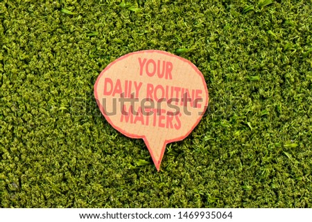 your daily routine matters concept speech bubble above green grass