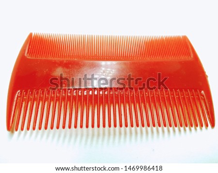 A picture of hair comb on white background