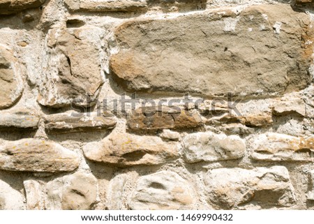 texture of masonry, the fragment of a stone wall of an ancient temple of the 10th century, background, backdrop