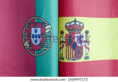 fragments of flags of Portugal and Spain close-up