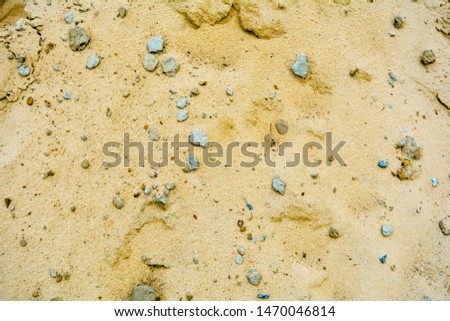 Pile of yellow sand background texture. Construction Supplies. Building materials pattern. Sand pile with small stones