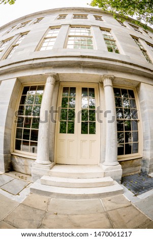 Entrance to an old building closeup with window reflections of trees