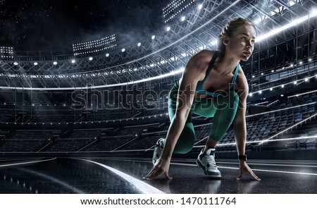 Sports background. Runner on the start line of the glowing stadium . Futuristic running track. Dramatic picture. Royalty-Free Stock Photo #1470111764