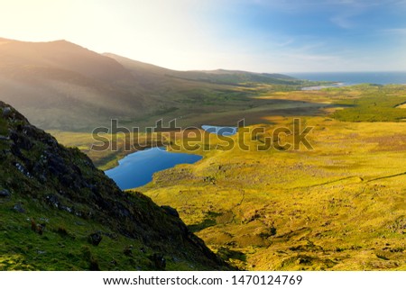 Conor Pass, one of the highest Irish mountain passes served by an asphalted road, located on the south-western end of the Dingle Peninsula, County Kerry, Ireland Royalty-Free Stock Photo #1470124769