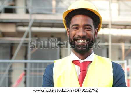Construction worker and architect outside
