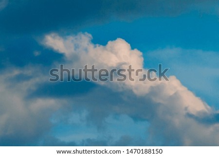Puffy clouds blue sky background.