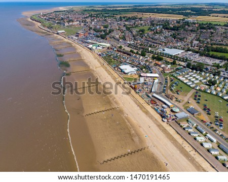 Aerial photo of the British seaside town of Hunstanton in Norfolk showing the coastal area and beach with caravans parks at the side of the beach, on a bright sunny day.