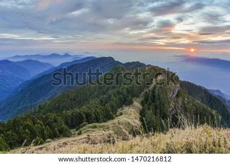 Landscape View Of The Holy Ridge And Nanhu Zhongyangjian Mountain With Amazing Sunriset On The Peak of Tao Mountaion, Wuling Quadruple Mountains Trail, Shei-Pa National Park, Taiwan Royalty-Free Stock Photo #1470216812