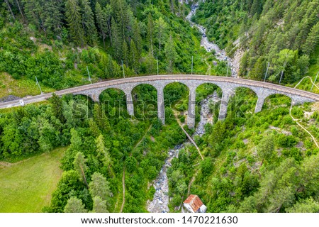 Famous viaduct near Filisur in the Swiss Alps - Switzerland from above - aerial photography