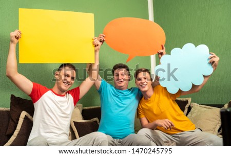 Happy family father and sons, holding speech bubbles 