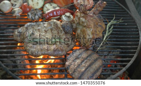bbq big juicy burger cutlet steaks and chicken legs for a picnic