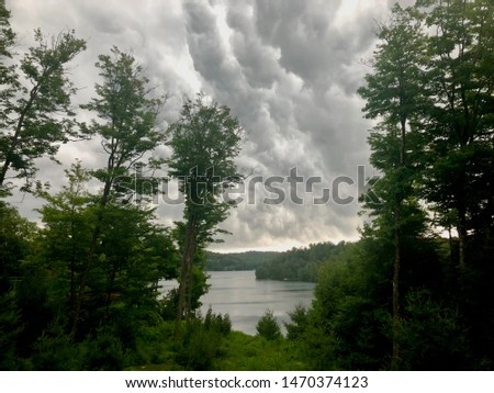 Summer storm clouds over lake at the cottage (Quebec, Canada)