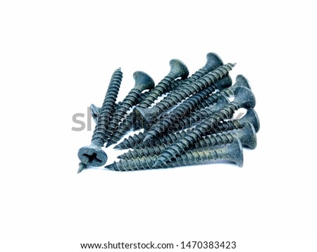 A picture of black screws on white background