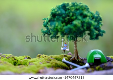 woman swing under the tree
